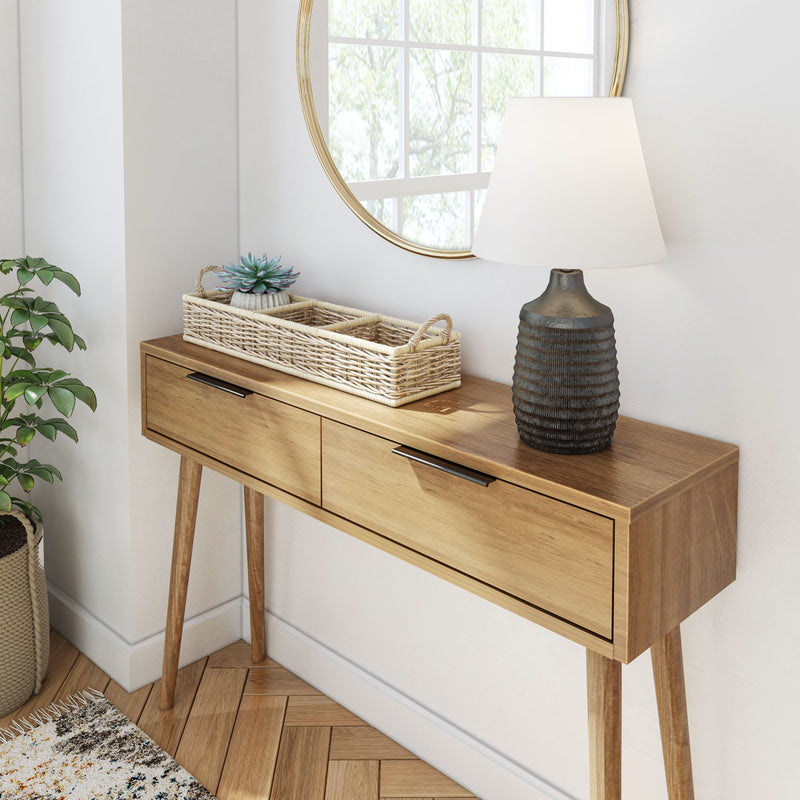 Modern wooden console table with sleek design and decorative items near a round mirror.