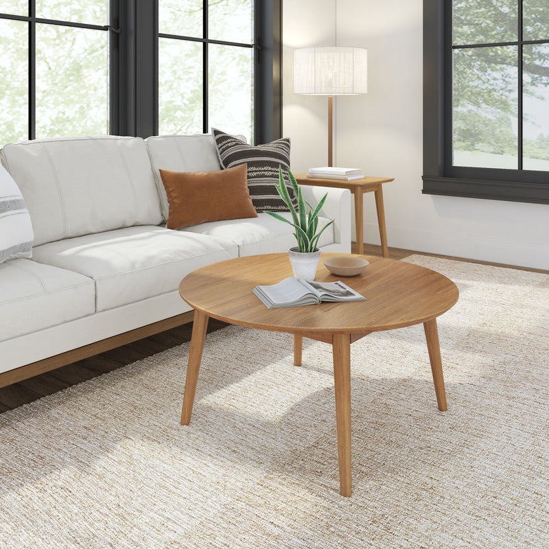 Modern living room with white sofa, wooden coffee table, and contemporary decor.