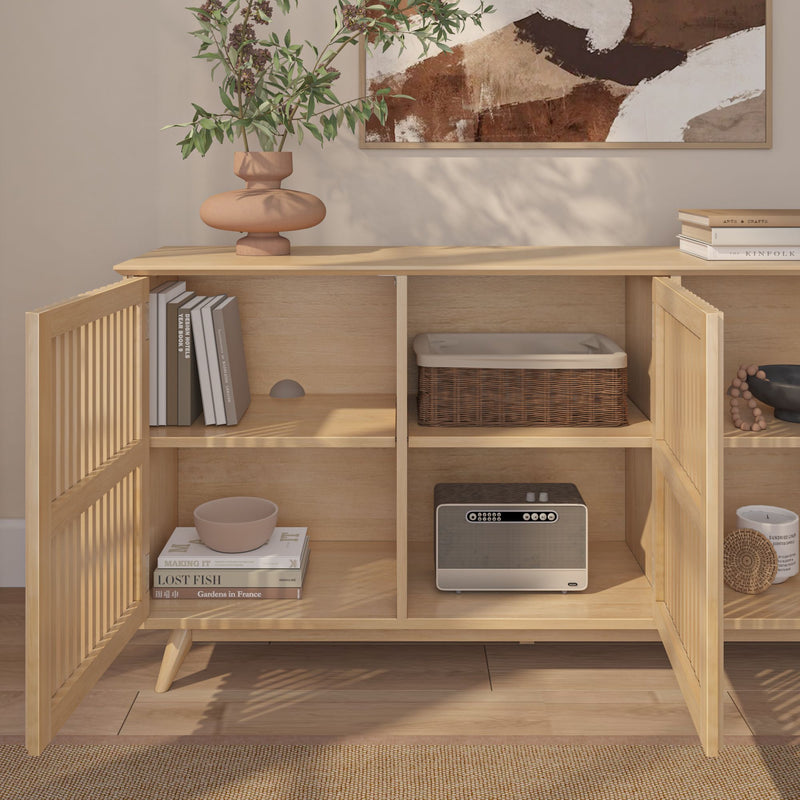 Light oak Scandinavian sideboard with open slatted doors, decorative vase, stacked books, woven basket and retro radio — modern living room storage console