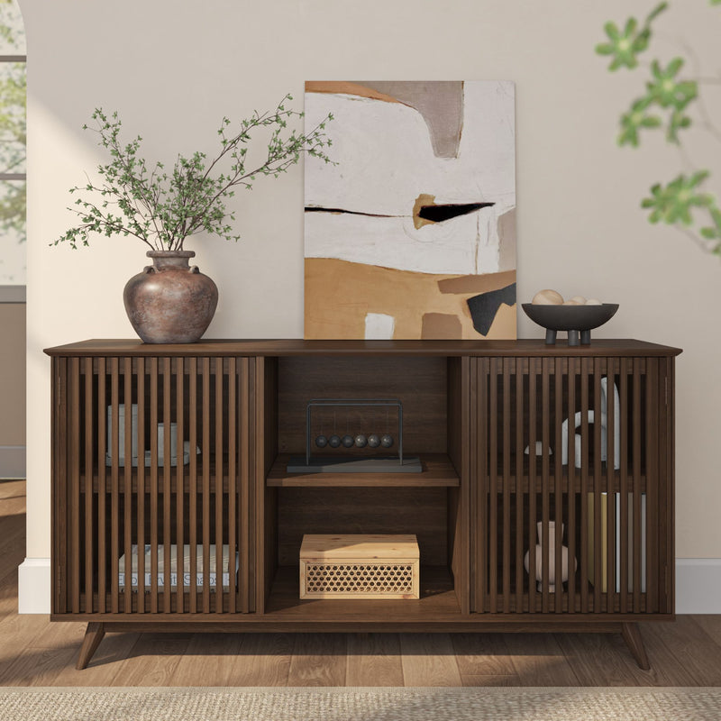 Mid-century modern wooden sideboard with vase and abstract art in stylish living room setting.