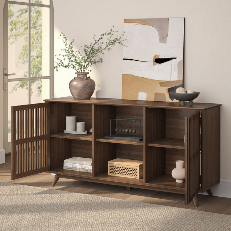 Stylish mid-century modern wooden sideboard with decorative items and abstract wall art in a bright living room.