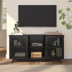 Modern black media console with open shelving and TV setup in stylish living room.