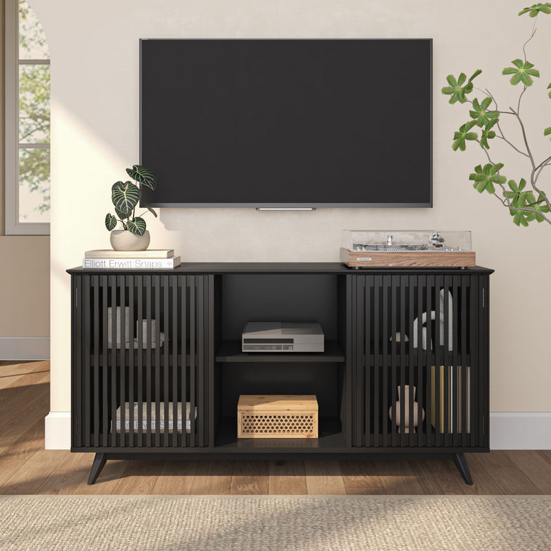 Modern black media console with open shelving and TV setup in stylish living room.