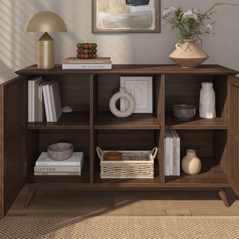 Stylish wooden bookshelf with decorative items, books, and modern home decor accents for living room inspiration.