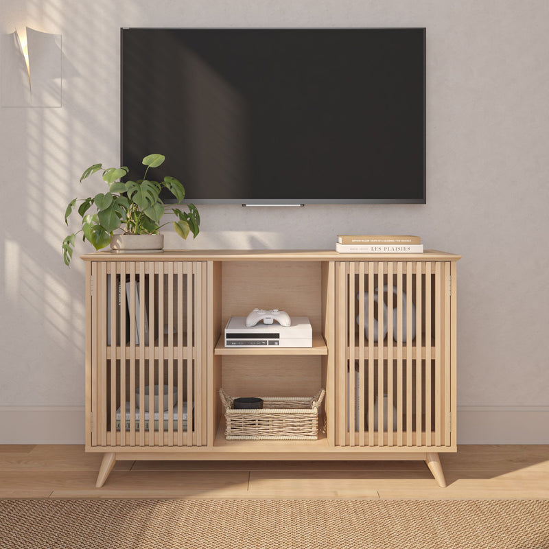 Modern living room with wooden TV stand, flat-screen television, and potted plant.