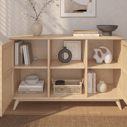 Modern wooden bookshelf with decorative items, books, and vases in a minimalist living room setting.