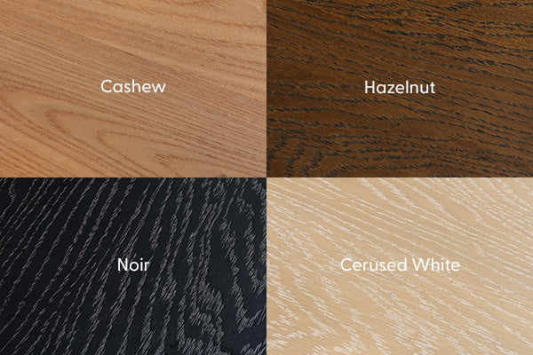 Four stained wood finish samples labeled Cashew, Hazelnut, Noir, and Cerused White displaying distinct grain patterns and color options for furniture, cabinetry, and flooring