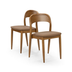 Set of two mid-century modern wooden dining chairs in light oak finish with tan faux-leather upholstered seats, curved backrests and tapered legs
