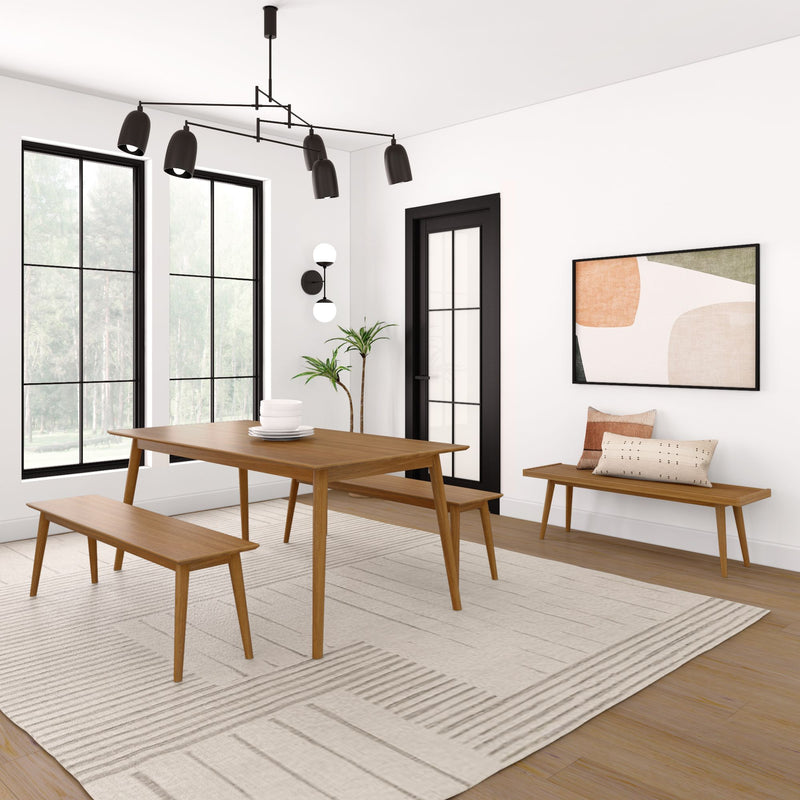 Modern dining room with mid-century wooden table and benches, black chandelier, abstract wall art, and natural light from large windows.