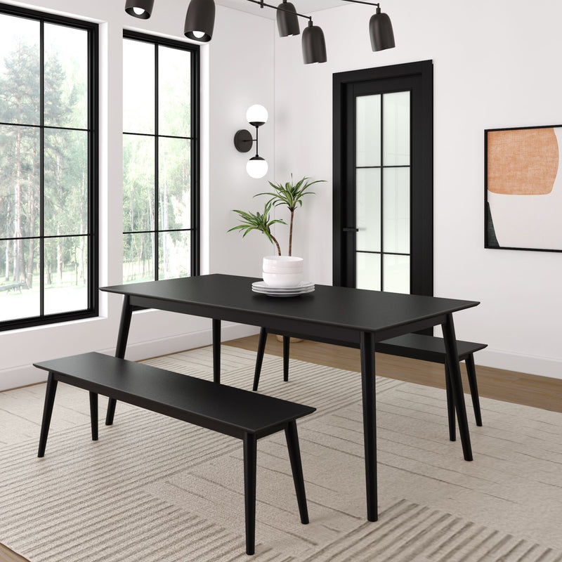 Modern dining room with black table and bench set, minimalistic decor.