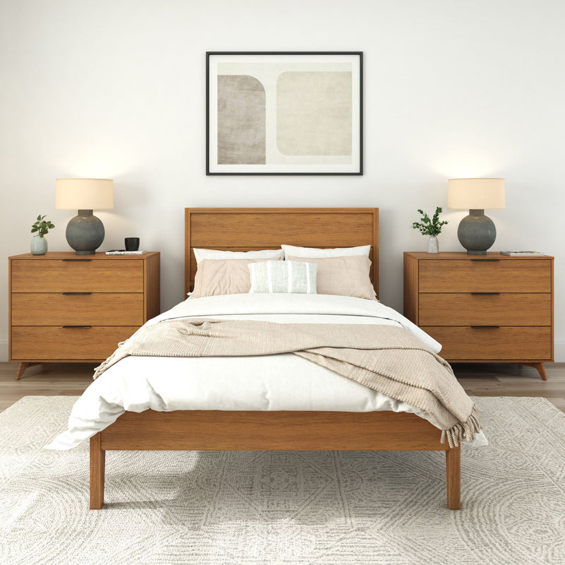 Stylish modern bedroom featuring a wooden bed frame, matching nightstands, and neutral decor for a cozy ambiance.
