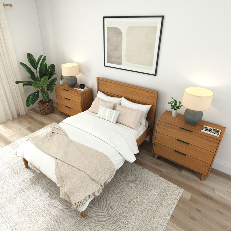 Modern bedroom with wooden bed, beige and white bedding, two wooden nightstands, soft lighting, and decorative plant.