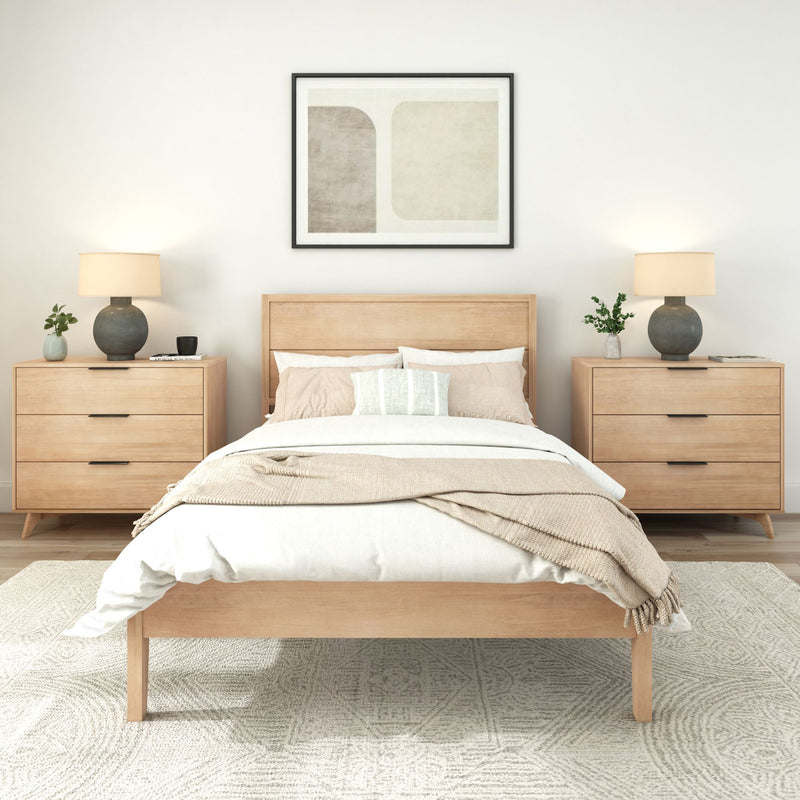 Modern bedroom with light wood furniture, neutral bedding, and minimalistic decor.