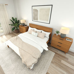 Modern bedroom interior with a wooden bed frame, stylish bedside tables, and cozy bedding.
