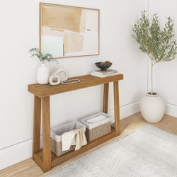 Minimalist entryway home decor: wooden console table with neutral abstract wall art, white ceramic vases, wicker storage baskets and potted olive tree