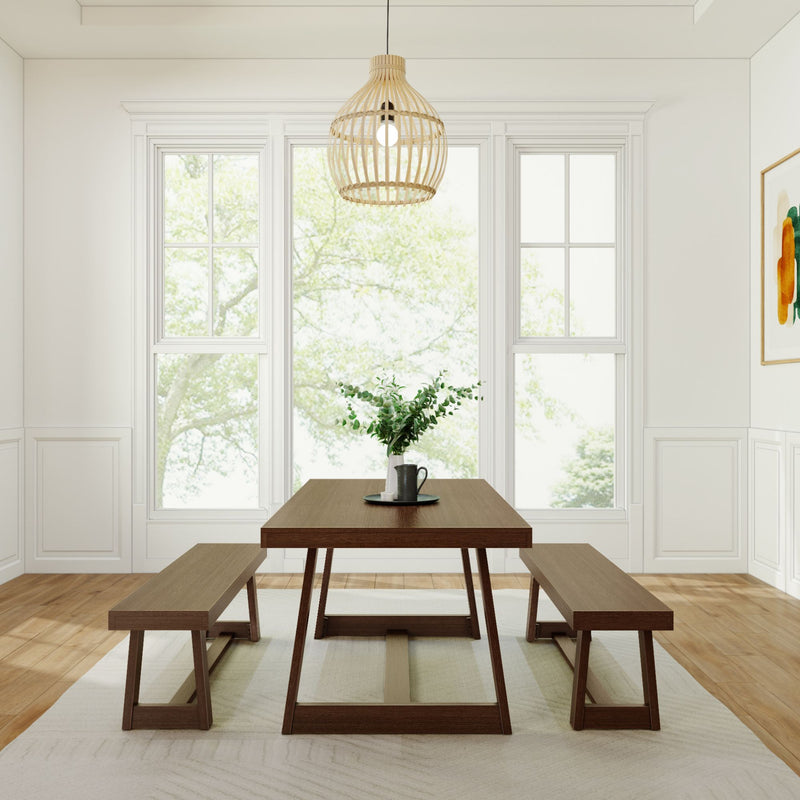 Modern dining room with wooden table and benches, featuring minimalist decor and large windows.