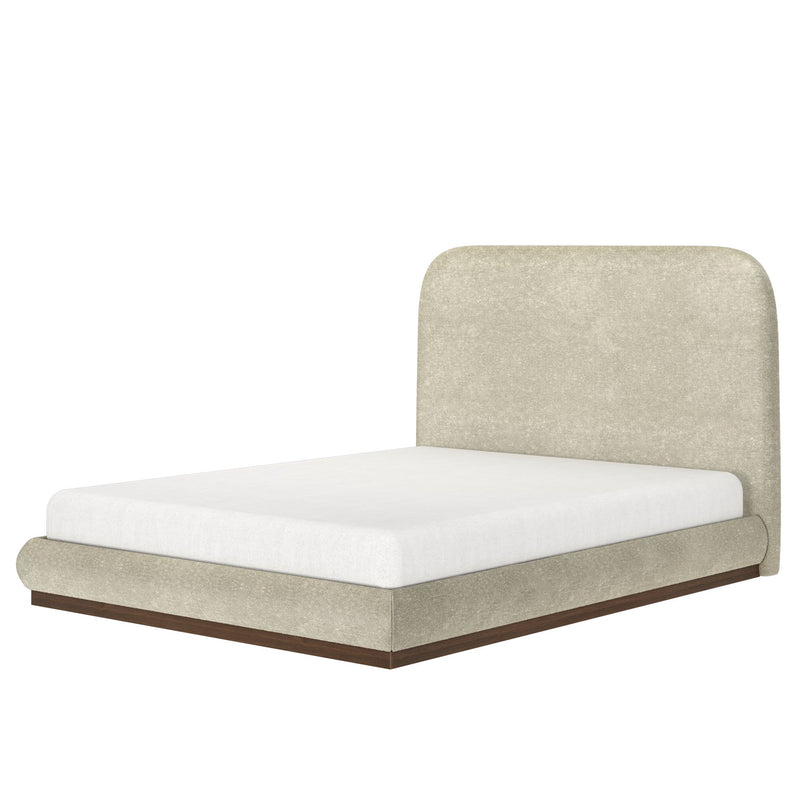 Modern beige upholstered platform bed with rounded headboard, white mattress and walnut wood base on white background