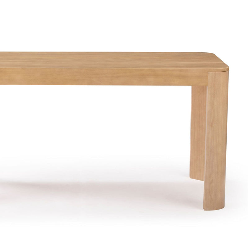 Modern wooden dining table with a natural finish and sturdy rectangular design.