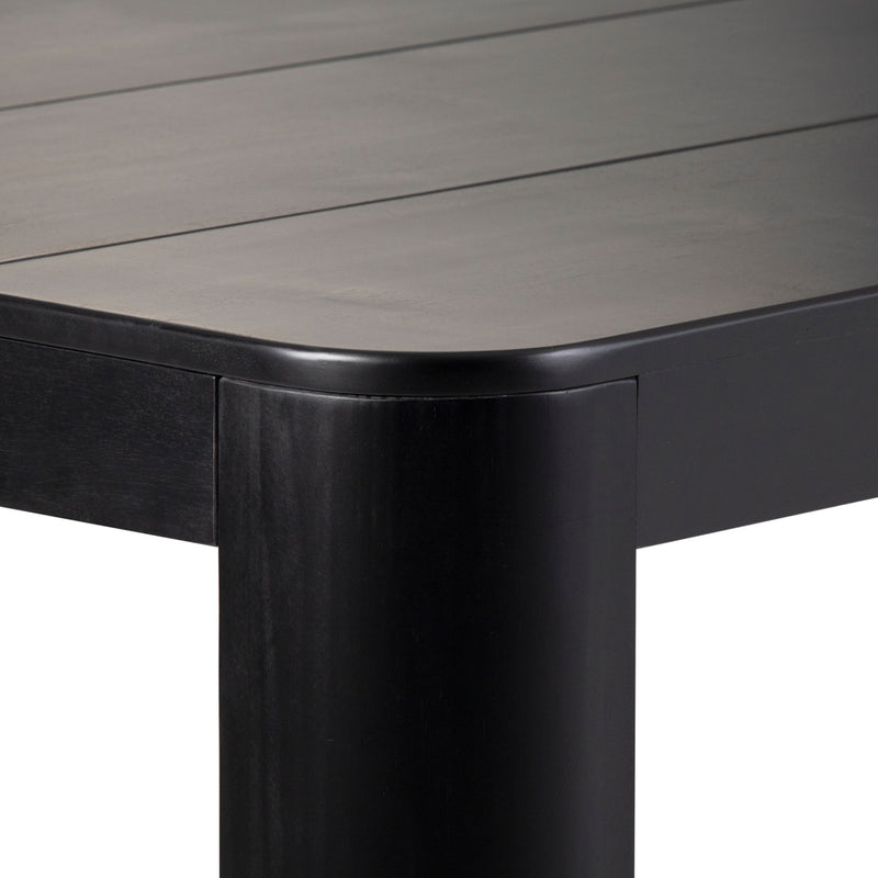 Modern black wooden table with a sleek, rounded corner design.