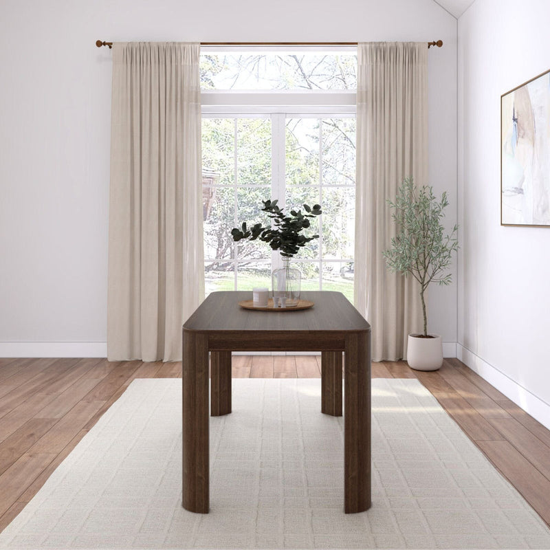 Elegant dining room with wooden table, large window, and minimalist decor.