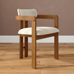 Mid-century modern solid wood dining chair with cream upholstered seat and backrest on hardwood floor against a taupe wall — minimalist kitchen and dining room seating