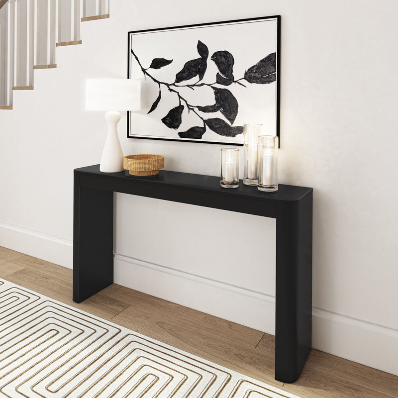 Modern black console table in elegant hallway with abstract artwork and decorative accessories.