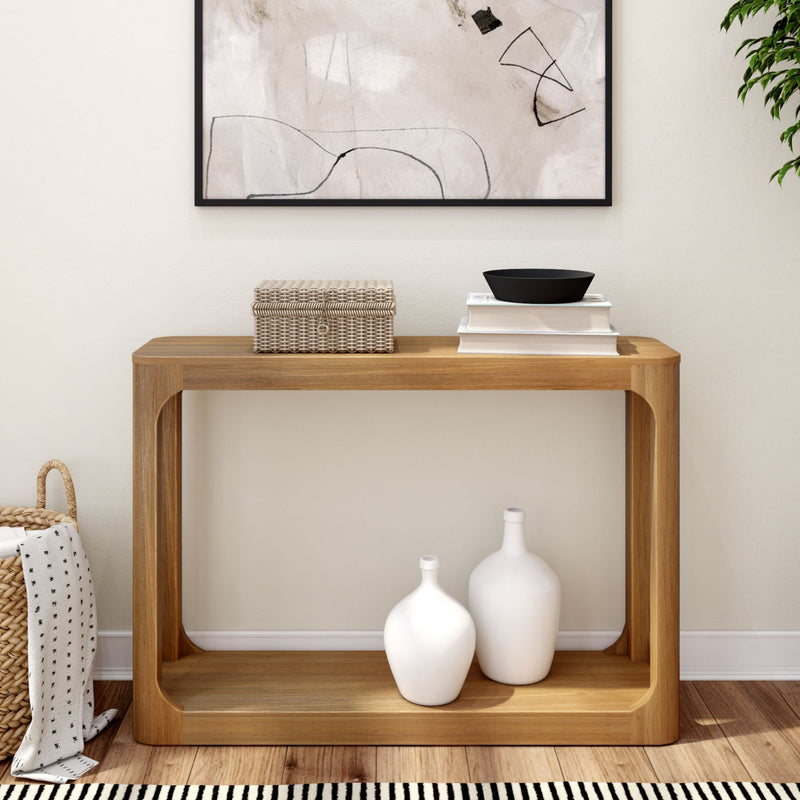 Modern wooden console table with decorative items in minimalist living room.