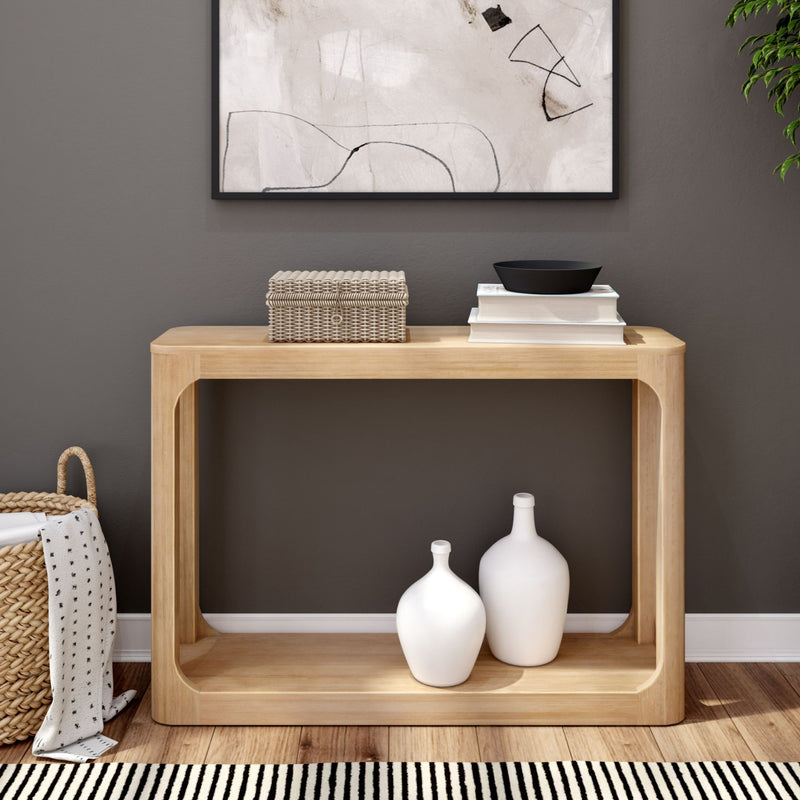 Minimalist wooden console table with decorative items and abstract wall art in modern living room.