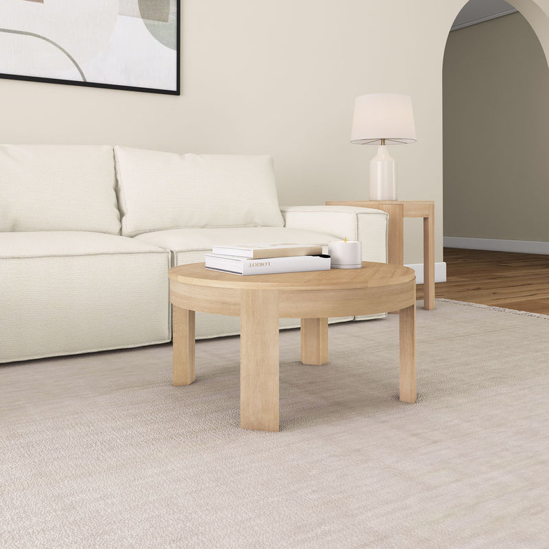 Contemporary living room with a cozy beige sofa, wooden coffee table, and modern lamp on a side table.