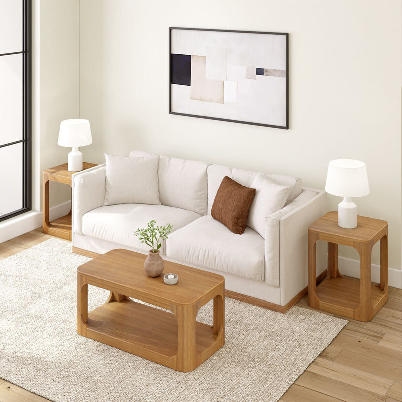 Modern living room with beige sofa, wooden furniture, and abstract wall art.
