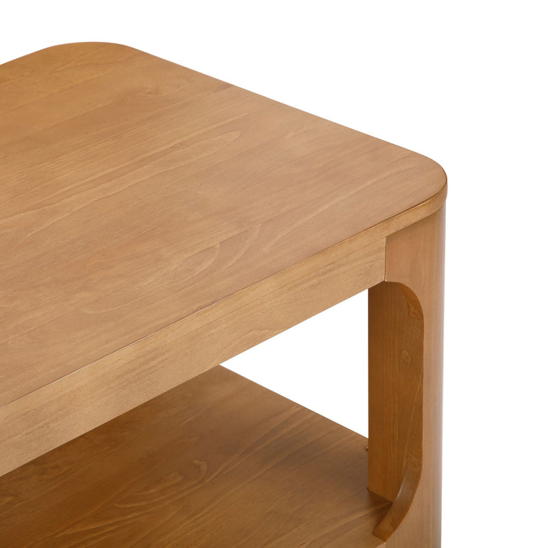 Wooden side table with a natural finish and rounded edges.