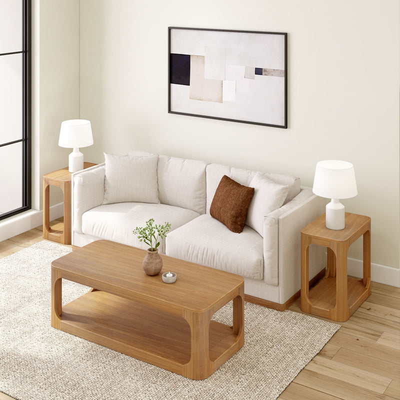 Modern living room with beige sofa, wooden coffee table, and stylish decor.