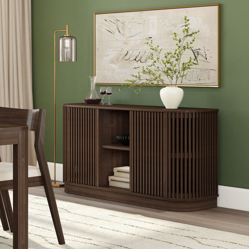 Mid-century modern dining room decor with dark wood slatted sideboard against green accent wall, abstract art, white ceramic vase with greenery, glass decanter and wine glasses, brass floor lamp