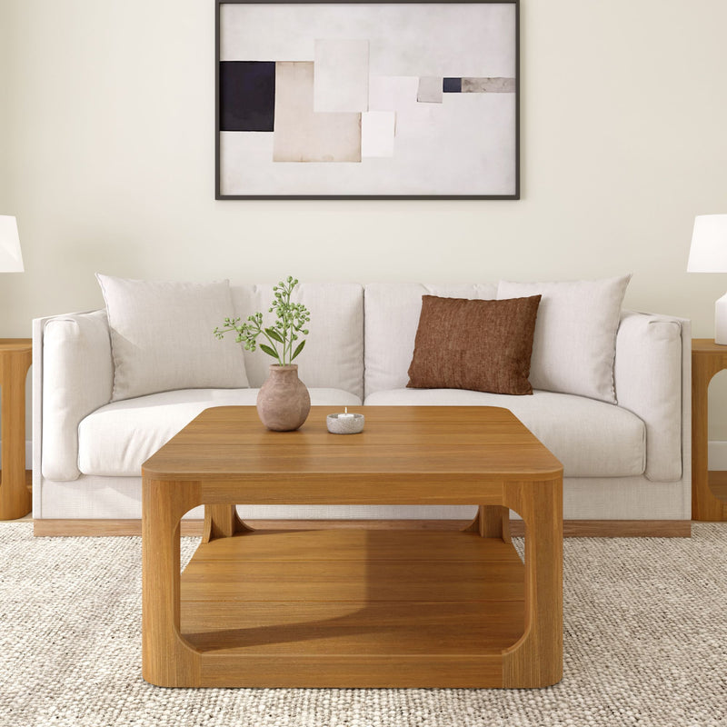 Modern living room with beige sofa, wooden coffee table, and abstract wall art.