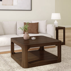 Modern living room with a wooden coffee table, white sofa, and decorative accents.