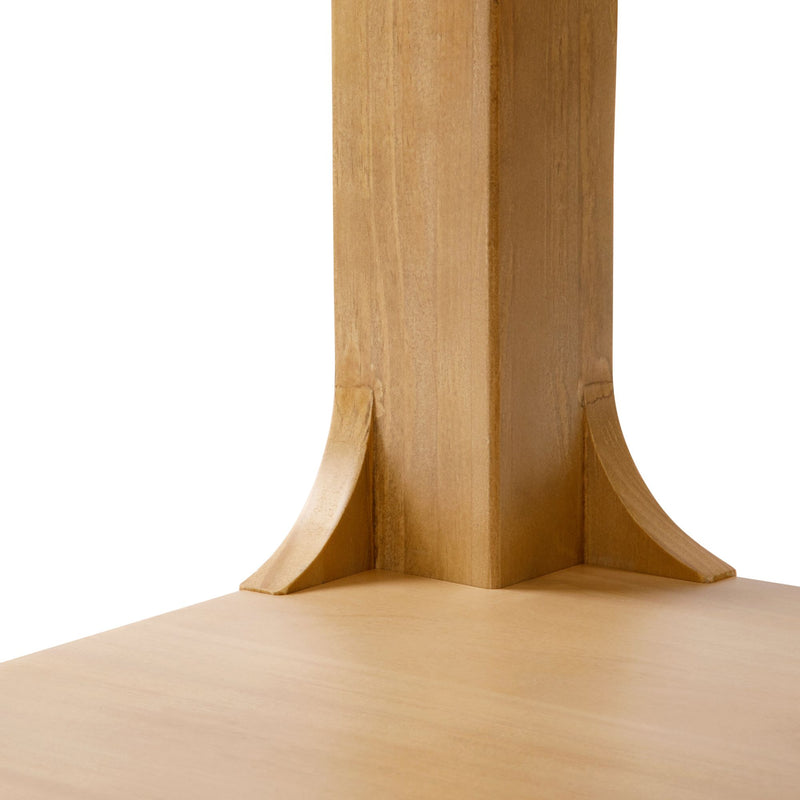 Natural wood dining table close-up showing sturdy design and craftsmanship.