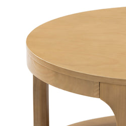 Round wooden table with smooth light brown finish and sturdy legs, ideal for modern interior design.