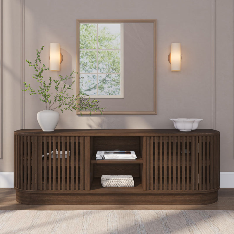 Modern living room with wooden sideboard, wall sconce lighting, and elegant decor.