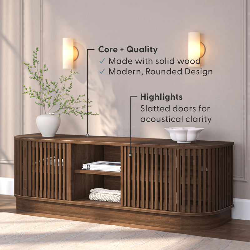 Stylish wooden media console with modern rounded design and slatted doors for acoustical clarity.