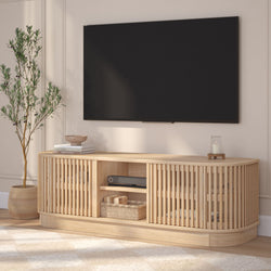 Modern living room with wooden TV console under a wall-mounted flat-screen TV.