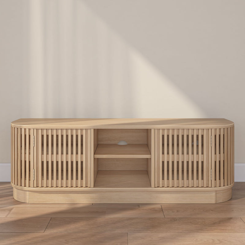 Modern wooden TV stand with slatted cabinet design in a minimalist living room.