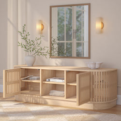 Modern wooden sideboard with open doors, featuring minimalist decor and a round mirror in a stylish living room setting.