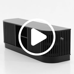 Black modern TV stand with slatted design and storage shelves.