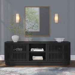 Contemporary living room with black sideboard, decorative vases, wall mirror, and modern lighting fixtures.