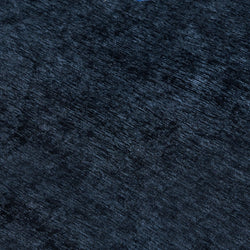 Close-up of navy blue crushed velvet fabric texture for luxury upholstery, cushions, and curtains