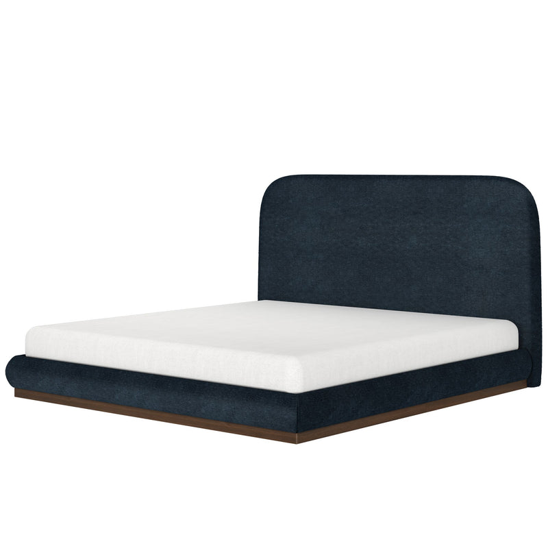 Modern dark blue upholstered bed frame with white mattress and wooden base.