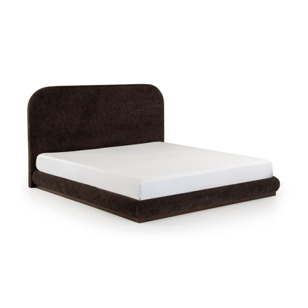 Minimalist low-profile dark brown upholstered platform bed with rounded headboard and white mattress on white background