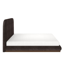 Modern upholstered platform bed with white mattress and dark fabric headboard.