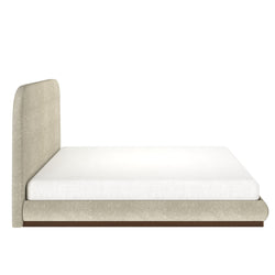 Luxurious beige upholstered bed frame with white mattress, modern bedroom furniture.