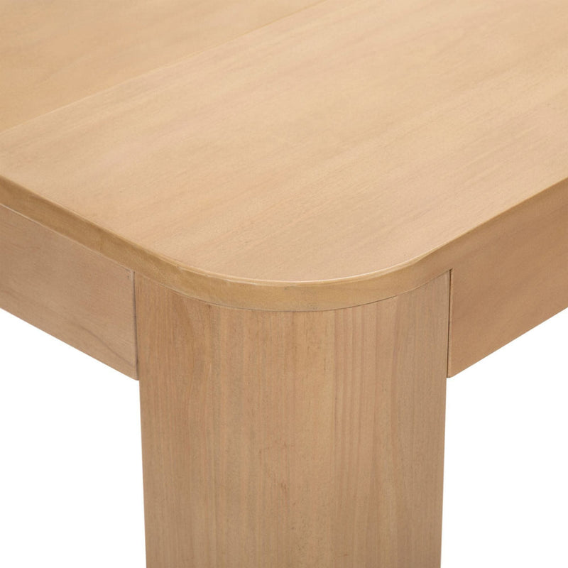 Modern light wood dining table corner with smooth finish and sturdy design.